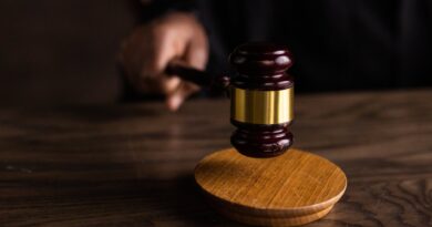 brown wooden gavel on brown wooden table