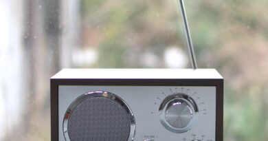 small retro radio set on wooden windowsill