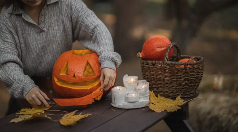 pumpkin on brown wooden table
