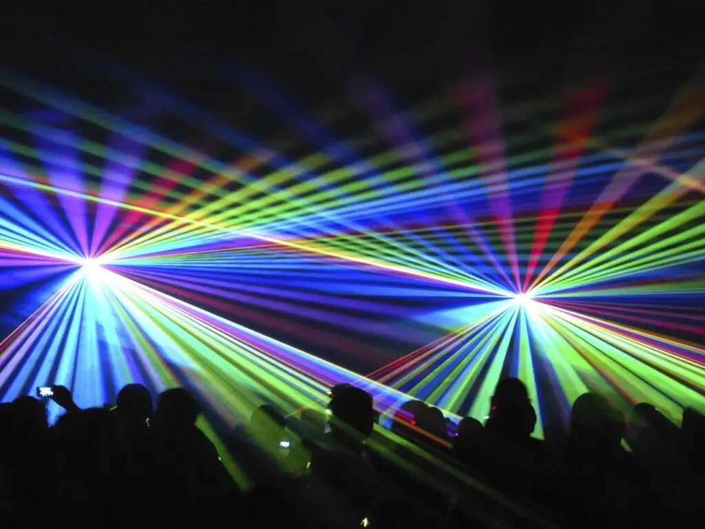 Concert lights beaming on audience