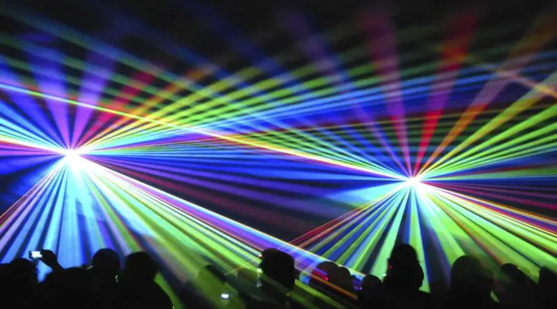 Concert lights beaming on audience