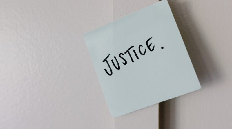the word justice written on paper