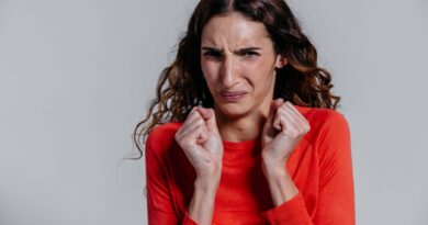 a woman with a disgusted facial expression