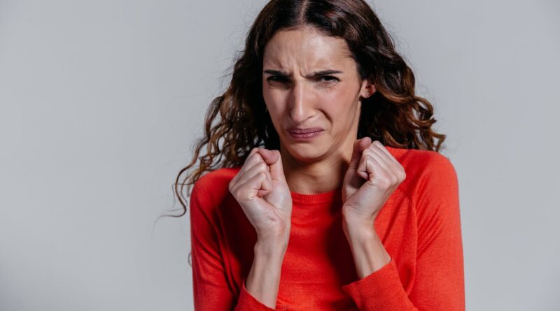 a woman with a disgusted facial expression